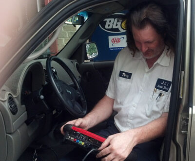 Mechanic checking car